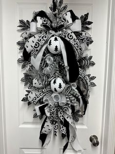 a black and white wreath on the front door