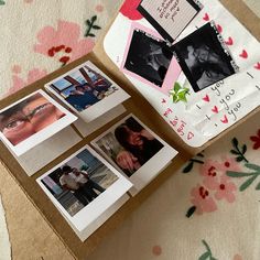 several polaroid photos are placed next to each other on a piece of cardboard with pink flowers