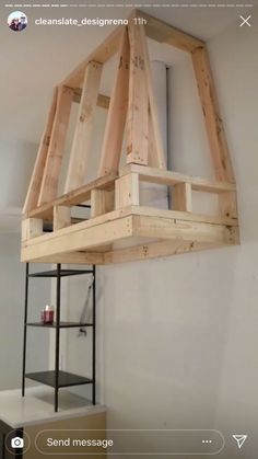 a wooden shelf hanging from the ceiling