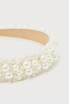 The Lulus Immaculate Icon Ivory Pearl Beaded Headband is an extra special way to create a look that everyone will love! This ultra-glamorous headband features a wide silhouette, embellished with varying sizes of gleaming faux pearls and shiny clear beaded details that create a luminous design throughout. Measure 13. 25'' from end to end. 1'' wide. 80% Plastic, 15% Polyester, 3% Glass. Imported. Lulus | Immaculate Icon Ivory Pearl Beaded Headband. Beaded Hair Accessories For Wedding, White Beaded Headband Jewelry, White Evening Headband, Adjustable White Beaded Headpiece, Cute Hair Accessories, Lulu Fashion, Beaded Headband, Cute Hair, Wide Headband