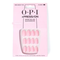 OPI's XPRESS/ON Nail Art Collection offers the highest professional quality press-on shades and nail art designs, for an instant gel-like salon manicure that lasts up to 14 days. features 14 days of wear Easy glue on application Reusable tips made with 94% PCR Packaging made with 100% PCR No need for LED/UV lamp Each set includes: nail glue, cuticle stick, dual nail file, buffer, OPI prep pad, 30 nails in different sizes Vegan how to use Fit Place each press-on over your natural nail to discover the right size, ensuring the number matches the tip of your natural nail Shape Tailor your nails to your liking by adjusting shapes and lengths with the Shape Up side of your file Prep Clip, file and lightly buff nails as needed Use Prep to xPress pad to remove dust Carefully push back the cuticles Mod About You Opi, Opi Mod About You, Natural Nail Tips, Short Pink Nails, Opi Pink, Best Press On Nails, Wella Color Charm, Nails Opi, Nail Effects