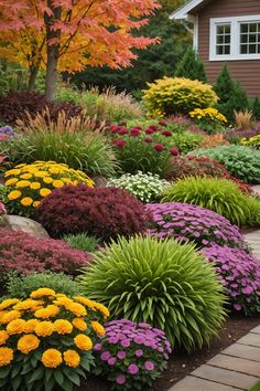 colorful flowers and trees in front of a house