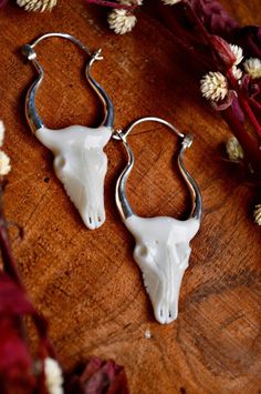 These stunning and unique designs were lovingly handcrafted from ethically sourced buffalo bone and high quality (nickel free) brass.  These statement earrings were made for the bold at heart!  Whether you're honouring yourself with a walk through nature or headed to a festival with friends, may these powerful pieces inspire you to be bold!        The buffalo skull symbolises abundance, provision, strength, stability and prosperity.          Hand carved with the intention of abundance. Festival With Friends, Wakan Tanka, Om Earrings, Buffalo Skull, Hummingbird Earrings, Bone Earrings, Crystal Hair Pins, Carved Bone, Bull Skull