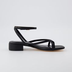 Meet Novella, the perfect heeled sandal for any occasion! With a soft vegan leather upper, Novella features an adjustable ankle strap, memory foam padding and a flexible, long lasting traction outsole for all-day comfort. Plus, the classic 1 inch block heel gives you a stylish, sophisticated blend, that can be suited towards any look. Bridesmaid Flat Shoes, Low Heels Sandals, Black Low Heel Sandals, Low Block Heels Outfits, 1 Inch Heels Sandals, Cute Low Heels, Sandals For Graduation, Dress With Flat Sandals, Low Black Heels