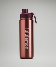 a pink water bottle with the word ummelo on it and a purple lid