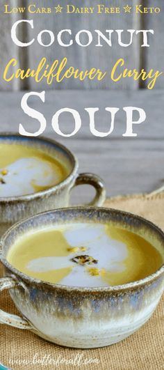 two bowls filled with soup sitting on top of a table