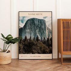 an image of yosemite national park poster on the wall next to a potted plant