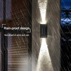 an outdoor wall light with rain coming out of it and the words rain proof design not afraid to wind and rain