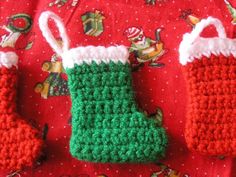 crocheted christmas stocking and mittens on a red blanket