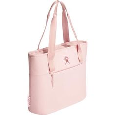 a pink tote bag with a cross on the front and side pocket, sitting in front of a white background