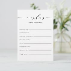 a wedding wish card with the word wishes written in cursive writing on it