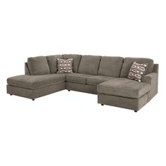 a large sectional couch with pillows on the top and bottom corner, in grey fabric