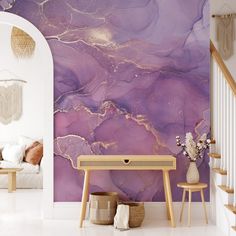 a living room with purple marble wallpaper and white stairs leading up to the second floor