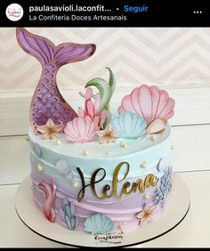 a cake decorated with an image of a mermaid