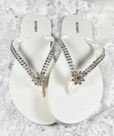 These beautiful white flip flops are  wrapped in white satin ribbon and the straps are adorned with a silver faux diamond mesh with a rhinestone butterfly in the center.  Ribbon color is white if you are needing other colors of ribbon or decoration please contact me and will be happy to accommodate you!   All flip flops are handmade to order and the production time is 1 to 2 weeks and then please allow time for shipping. Amazing for beach, weddings, flower girl or a fancy event, you choose! Plea Bridesmaid Flip Flops, Bridal Flip Flops, White Flip Flops, Wedding Flip Flops, Black Bridal, Heel Slippers, Mesh Ribbon, White Satin, Ribbon Colors