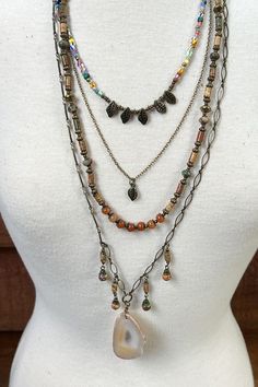 Five layer necklace with unique multi colored beads. A glass agate like pendant. Lobster claw closure. Vibe Tribe, Double Layer Necklace, Layering Necklaces, Hippie Vibes, Blouse Tank Top, Layer Necklace, Bathing Suit Covers, Bohemian Necklace, Hippie Jewelry