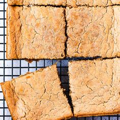 several pieces of bread sitting on top of a cooling rack