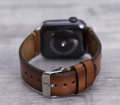 Genuine leather brown sport Apple watch strap for series 1-6 & SE. This watch strap is medium size and fits 150-190mm wrists. Seven different color options for adapters (Silver, Black, Space Gray, Rose Gold, Yellow Gold, Red and Blue). Adapter color and buckle color will be same. Shipping: Shipping within US takes usually 3 business days via USPS/FedEx, to Europe 1 business day via TNT Express. We normally send the orders in 1 or 2 business days. Customization: We can write messages, names, Modern Brown Watch Band For Business, Business Brown Bracelet Strap Apple Watch Band, Modern Brown Adjustable Watch Accessories, Modern Adjustable Brown Watch Accessories, Adjustable Bracelet Strap Apple Watch Band For Business, Classic Brown Apple Watch Band For Business, Modern Brown Watch With Wrist Strap, Leather Anniversary, Band Fits