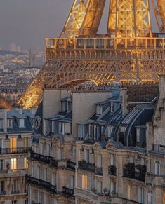 the eiffel tower in paris is lit up at night with lights on it