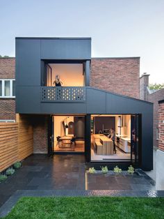 a modern house with an open floor plan and large sliding glass doors on the outside