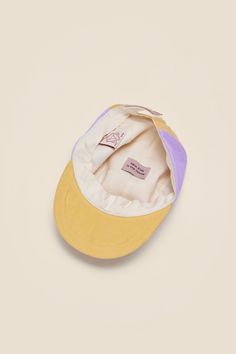 Calvin is a 5-panel cap for kids aged between 2 and 15. It is adjustable, so it grows with your kid. Calvin is available in two sizes (see size information below) The miami sunrise model comes in rose, lavender and yellow shades and has the NKITH snake-logo on the front label. Like all NKITH summer caps it is made from pre-used bedlinen. The cap has a light cotton lining and comes with NKITH signature soft visor. – made from pre-used bedlinen– cotton lining– bendable soft visor– adjustable self- Adjustable Fit Six-panel Baseball Cap For Summer, Summer Six-panel Baseball Cap, Adjustable Yellow Hat, Casual Baseball Cap For Summer Playtime, Adjustable Fit Summer Six-panel Hat, Adjustable Baseball Cap For Summer Playtime, Summer Playtime Baseball Cap, Yellow Adjustable Baseball Cap With Curved Visor, Adjustable Yellow Hat For Playtime