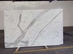 a large white marble slab in a warehouse