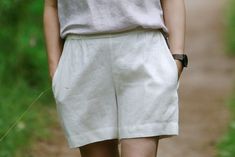 "FREE FedEx EXPRESS upgrade delivery for order over 100 EUR (exception - remote areas and Australia or New Zealand). FREE gift for all orders - our linen color samples. Linen shorts MARKS - short women's shorts features elastic waistband, two side pockets and has relaxed fit. Perfect for warm summer days and comfortable loungewear hanging at home. FABRIC: 100% pre-washed softened linen, 205 g/m2, 6 oz/yd2 OEKO-TEX standards certified linen The length of the shorts are around 19.9 inches (43 cm). Model is wearing M size in color - Cloud white. The model is 5'7\"/172 cm - bust 35in/89cm, waist 29.1in/74cm, hips 38.9in/99cm. Model usually wears S or M size. Size chart and color options can be found in last listed pictures. Please choose color and size from the side menu.  *actual color may va Womens Linen Shorts, Summer Shorts Women, Linen Shorts Women, Comfortable Loungewear, Linen Summer, Fedex Express, Shorts Women, Beach Shorts, Linen Shorts