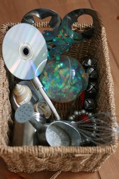 a basket filled with assorted items on top of a wooden floor