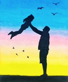 a person holding a child in their arms with birds flying around