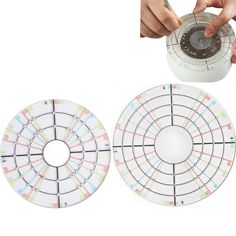 two circular coasters being held by hands