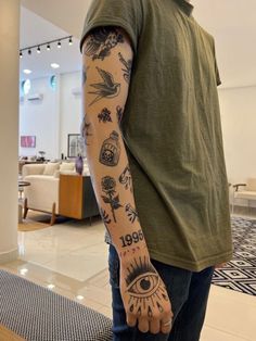 a man with many tattoos on his arm