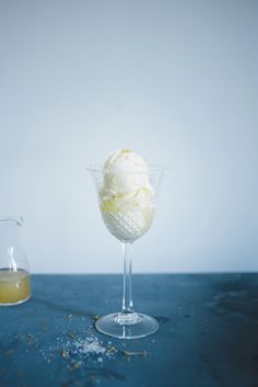 an ice cream sundae in a glass next to a beaker