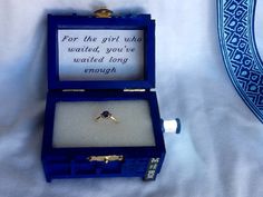 a blue box with a ring in it