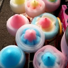 several colorful candles are sitting on the ground