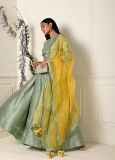 Featuring a sage green anarkali in raw silk base with hand embroidery on the yoke. It is paired with a contrast yellow dupatta in organza base.Care:Dry Clean OnlyComposition:Raw Silk Green Organza Salwar Kameez With Cutdana, Green Anarkali Organza Kurta, Green Anarkali Kurta In Organza, Green Floor-length Raw Silk Dupatta, Green Organza Kurta For Diwali, Green Organza Dupatta For Navratri, Green Tissue Silk Dupatta For Navratri, Green Anarkali Organza Sharara, Green Anarkali Sharara In Organza