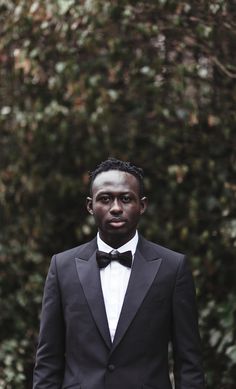 a man in a tuxedo and bow tie