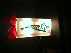 a lighted gift bag with a christmas tree on it