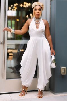 Step into the spotlight with our Ivory Serenity Jumpsuit. This exquisite piece combines the sophistication of a gown with the comfort and versatility of a jumpsuit. Perfect for weddings, gala events, or any occasion where you want to make a refined statement. Non-stretch jumpsuit Sleeveless/Halter Zipper closure 100% polyester Hand wash cold Inseam is 30 inches Model is wearing a small Formal Jumpsuits For Women Wedding, Jumpsuits For Women Wedding, Formal Jumpsuits For Women, Formal Jumpsuits, Stretch Jumpsuit, Formal Jumpsuit, Gala Events, Piece Dress, Wedding Theme