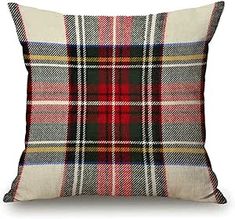 a plaid pillow is shown on a white background with black and red accents, which are accented with the same color as the fabric