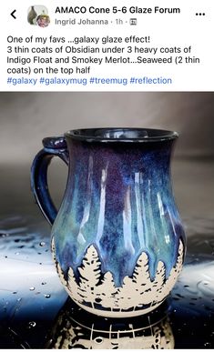 a blue and white vase sitting on top of a table next to water droplets with trees painted on it