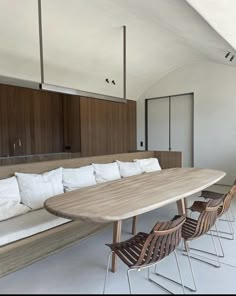 a long table and chairs in a room