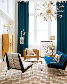 a living room filled with furniture and a chandelier