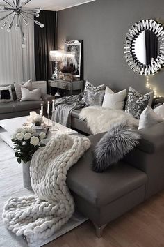 a living room filled with furniture and pillows