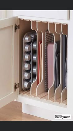 an organized kitchen drawer with various items in it