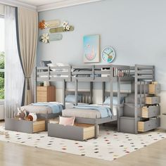 a child's bedroom with bunk beds and drawers