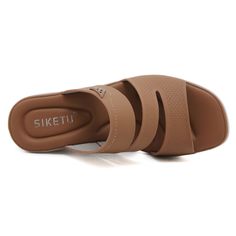 Upgrade your summer wardrobe with Siketu's Rica Cushioned Wedge Slides in brown. These stylish and comfortable slides provide cushioned support with a trendy wedge design, making them the perfect addition to any outfit. Elevate your fashion and your comfort with these must-have slides. 2.36'' heel Slip-on PU upper Synthetic Arch support footbed™ Cushioned Insole™ Anti-skid rubber sole Brown Cushioned Slide Wedge Sandals, Casual Brown Slide Wedge Sandals, Brown Wedge Sandals With Ortholite Insole For Summer, Summer Brown Wedge Sandals With Ortholite Insole, Brown Slides With Ortholite Insole For Summer, Comfortable Brown Wedge Sandals For Vacation, Casual Brown Wedge Sandals With Ortholite Insole, Comfortable Brown Wedge Sandals With Cushioned Footbed, Brown Synthetic Wedge Sandals With Arch Support