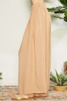 Introducing our fabulous Wrap Pleating Detail Wide Leg Pants. These pants are the epitome of modern elegance and sophistication. The wrap pleating detail adds texture and visual interest, while the wide leg silhouette provides a chic and flattering fit. Made with high-quality fabric, these pants are comfortable, breathable, and perfect for any occasion. Dress them up with a blouse and heels for a polished and refined look, or dress them down with a simple tee and sneakers for a more casual yet s Balloon Sleeve Dress, Simple Tee, Evening Dresses Plus Size, Simple Tees, Maxi Dress Cocktail, Maxi Dress Formal, Dress With Cardigan, Formal Evening Dresses, Basic Style