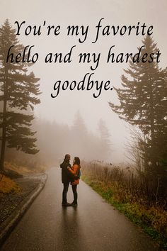 a man and woman standing on a road with trees in the background that says, you're my favorite hello and my hard goodbye