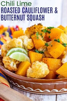 grilled cauliflower and butternut squash in a brown bowl with lime garnish