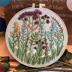 an embroidery kit with flowers on it